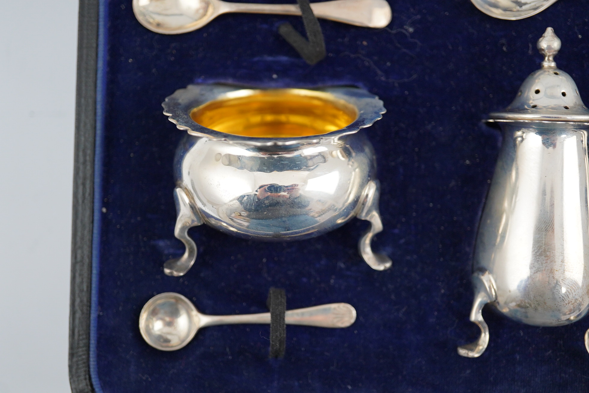 A George V cased silver seven piece condiment set by Horace Woodward & Co Ltd